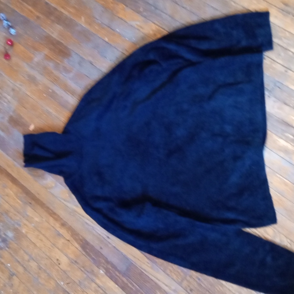 This is a turtle neck long sleeve fuzzy shirt